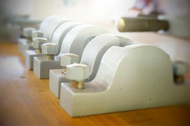 WEB_row of metal clamps